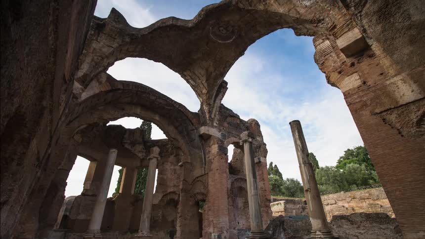 Clouds float over old stone ruins