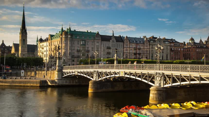 The busy bridge leads to the city