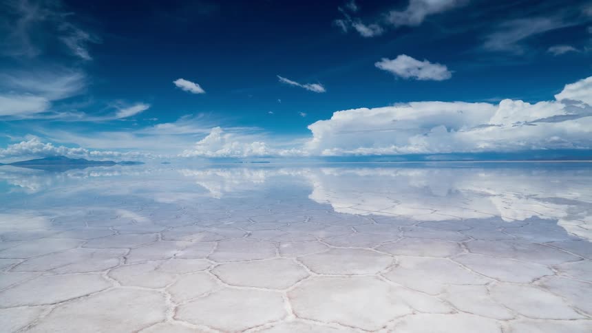 Clouds float over a calm lake