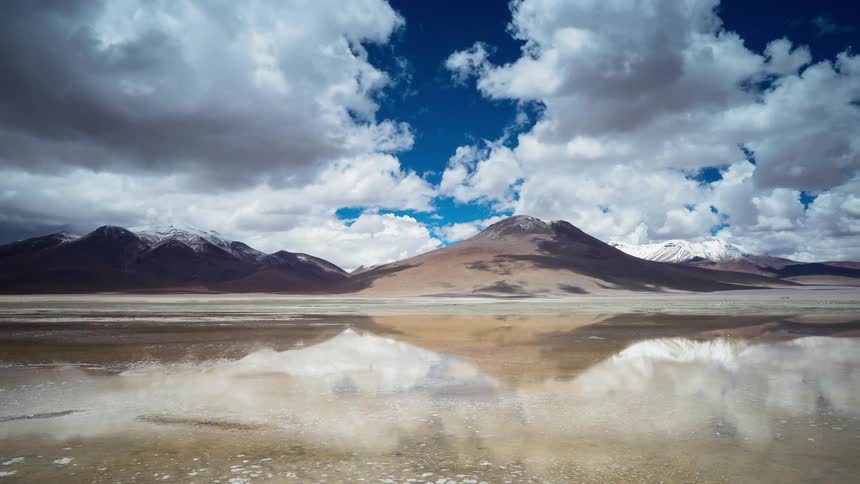 Clouds pass above the mountains