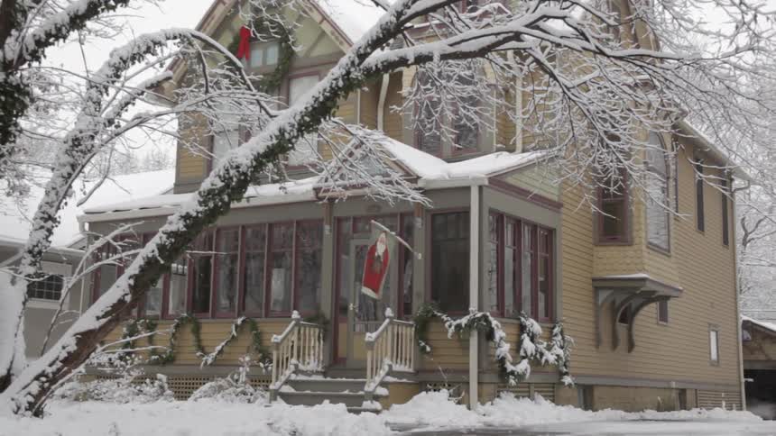 There is heavy snow around this home