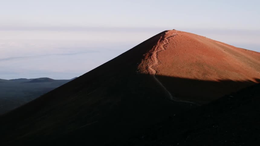 Sunlight shines on a mountain peak