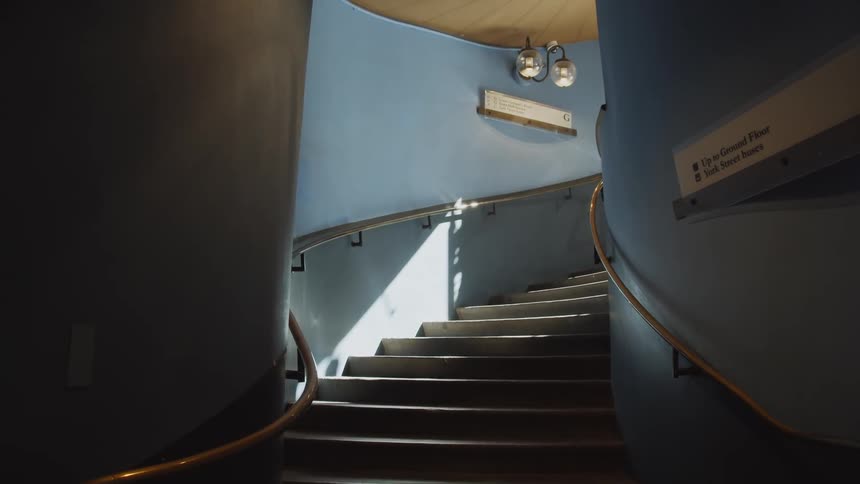 Looking up a curved stairway in an office building