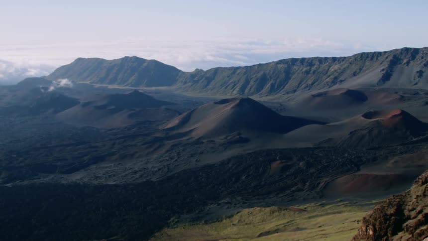 Rolling dark brown hills cover the landscape