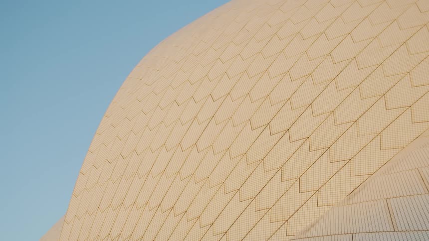The side of a building is shown on a clear day