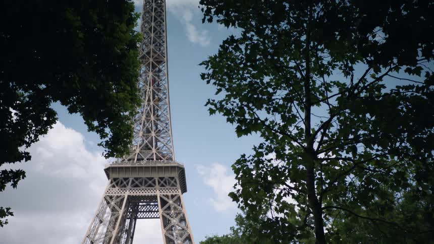 Tower behind trees on a cloudy day