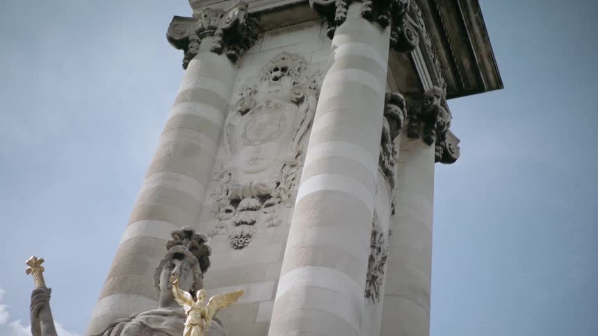 Pillar with stone and gold sculptures