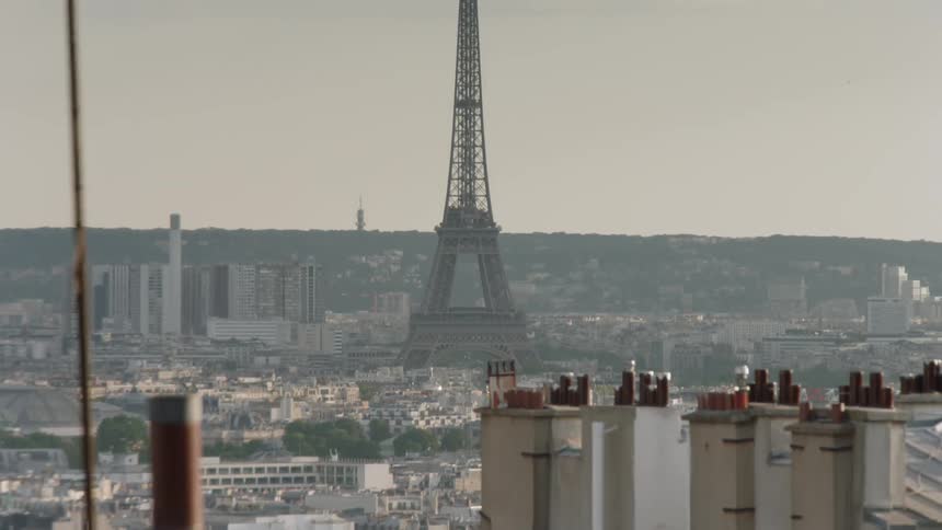 Tower stands taller than the many buildings surrounding it