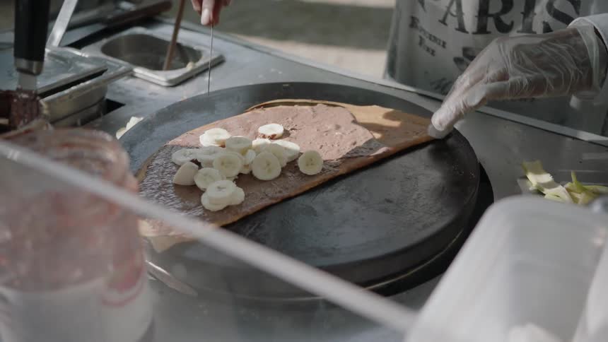 Baker prepares a banana pastry
