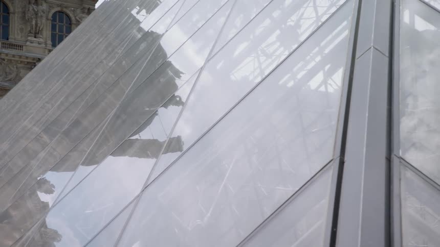 Looking at the louvre glass pyramid in bright sunlight