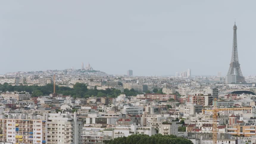 The Eiffel tower looms over the city of Paris