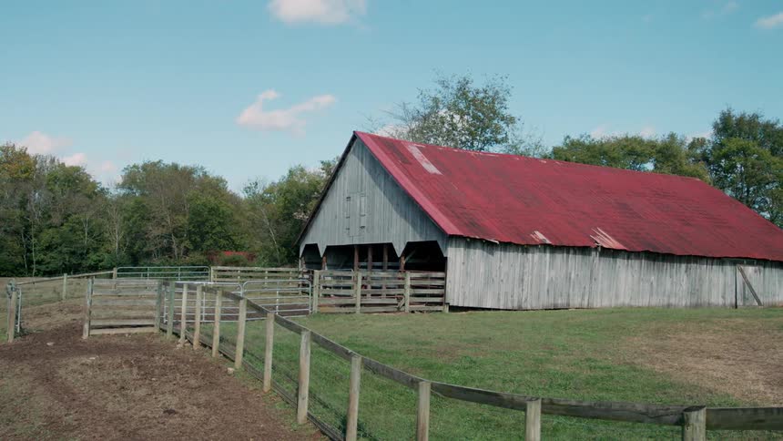 Horse stable with a red roof