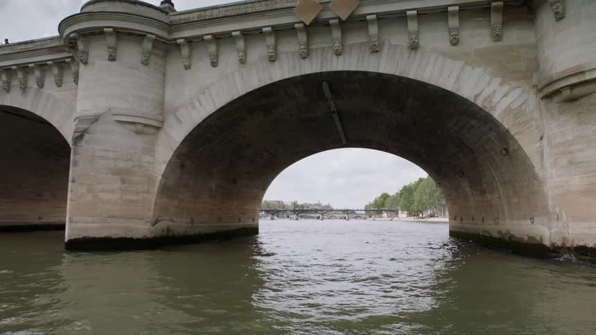Water flows under a large bridge