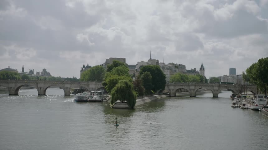 A bridge over a lake in a  city