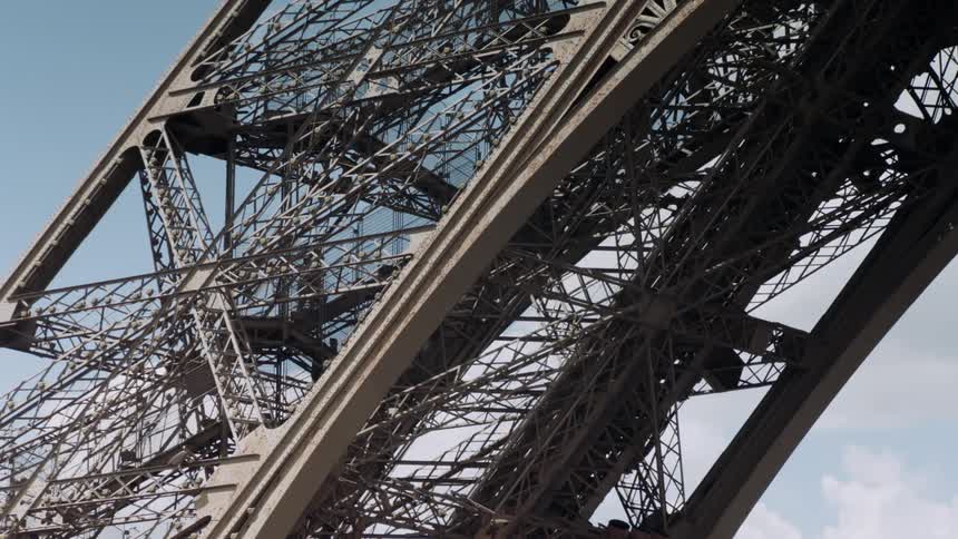 People climb the eiffel tower