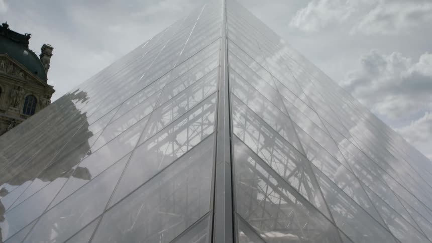 Clouds reflect in building windows