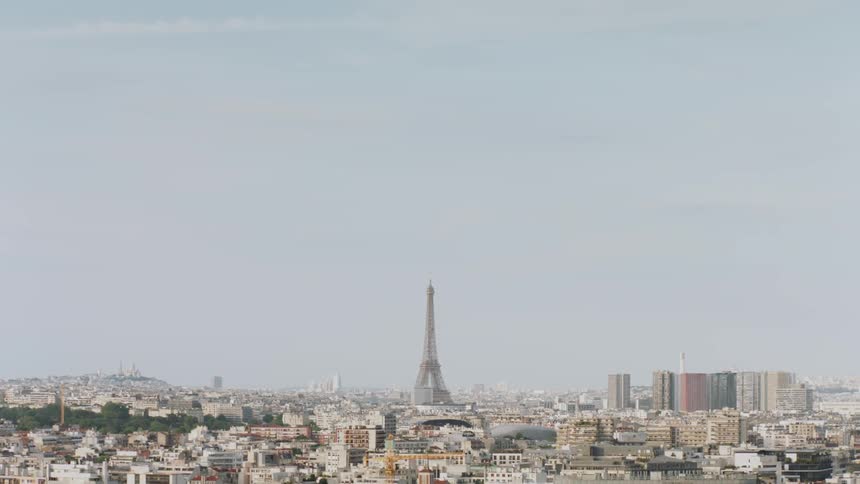 Tower stands taller than the many buildings surrounding it