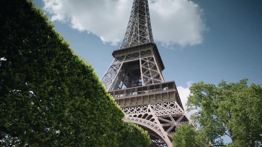 Tower surrounded by trees on a partly cloudy day