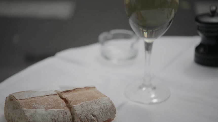 Bread and white wine on a table