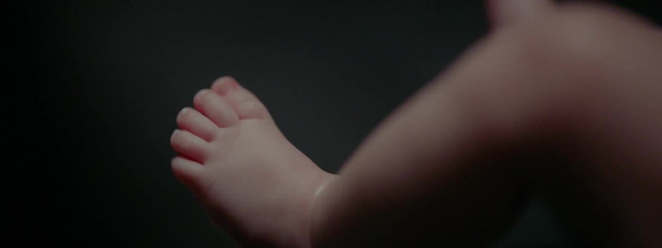 A baby's foot is shown unmoving