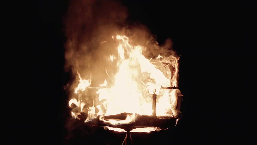 The chair is spinning while it is on fire