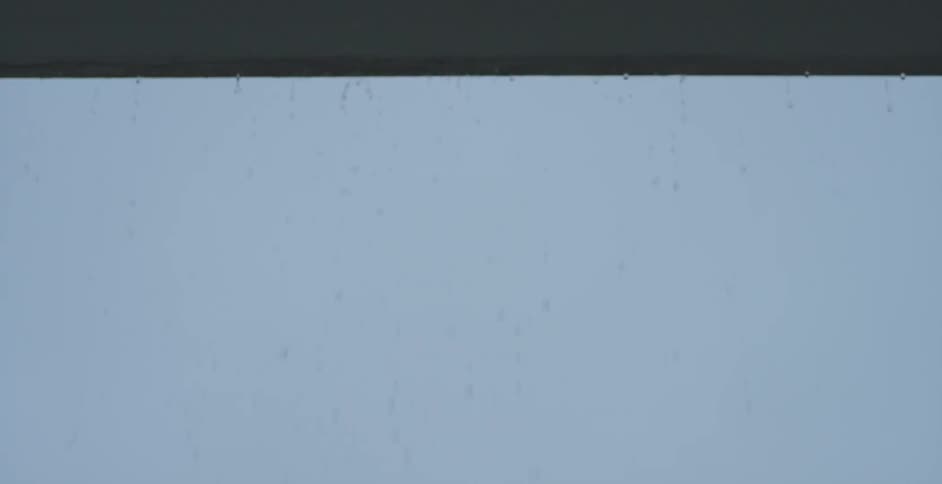 Rain dropping slowly off a ledge