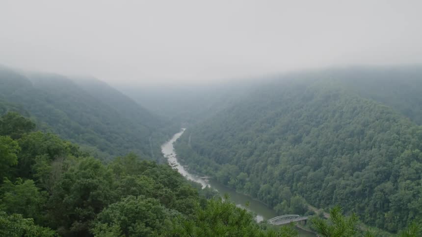 A river winds through a mountain landscape
