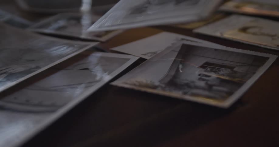 A person looking at an old photograph