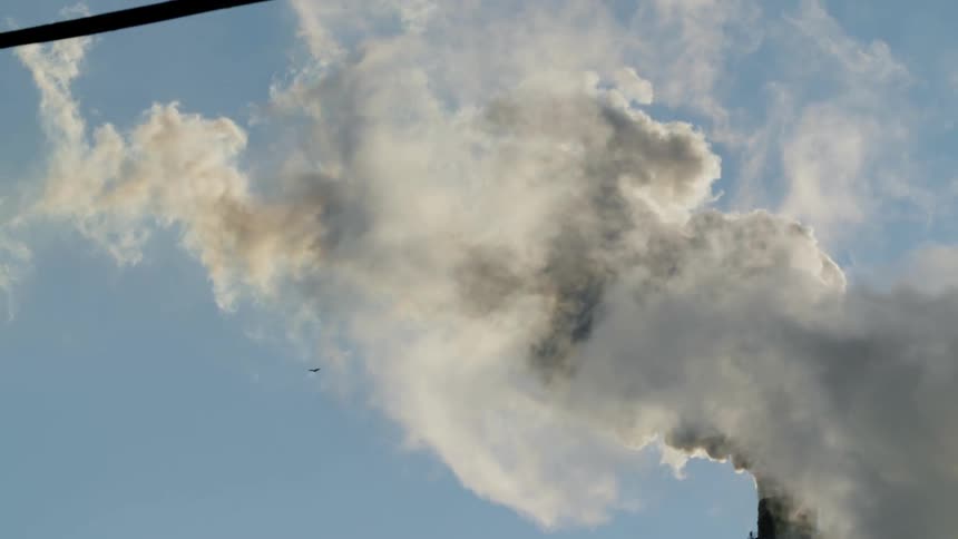 Smoke pours into the sky