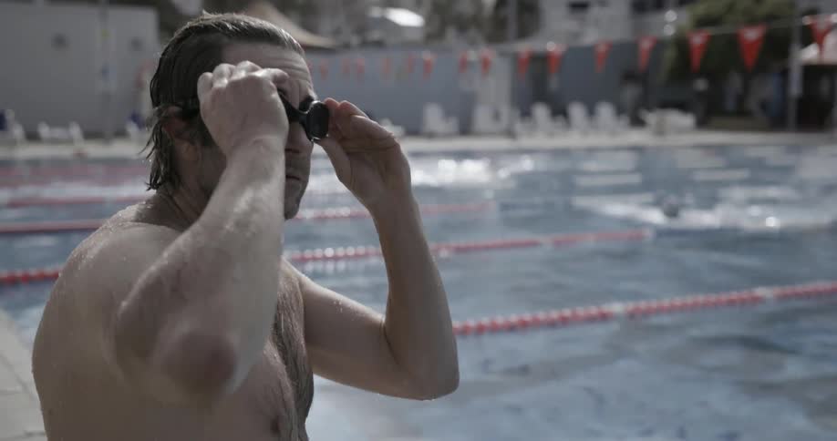 Man jumps into a swimming pool