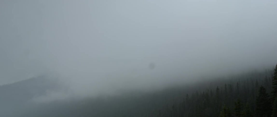 Clouds float over a mountain