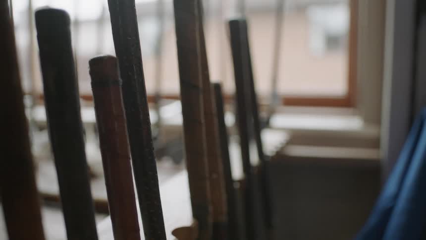 Golf clubs are displayed in a rack