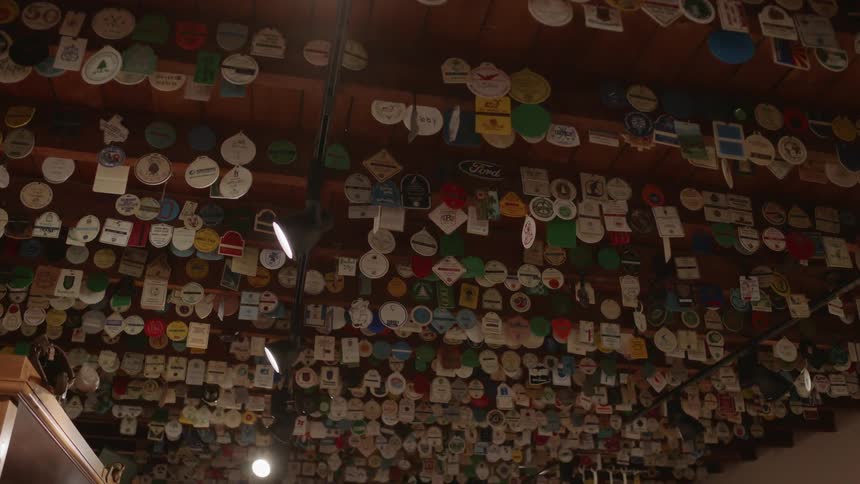 Tags hang from a ceiling