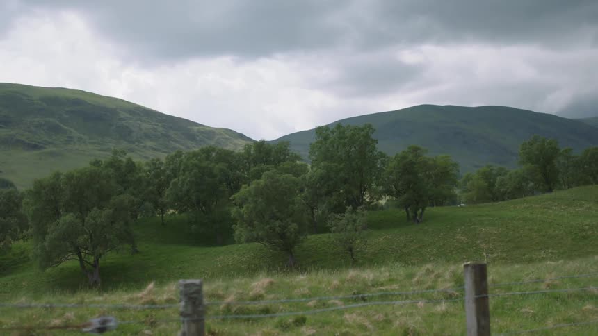 Green mountains and hills on a cloudy day