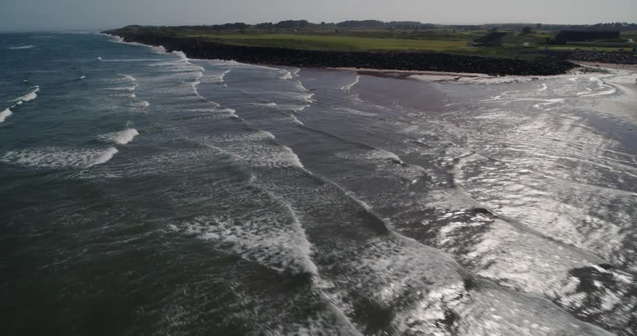 Waves roll into the shore