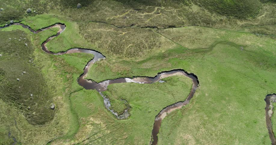 A stream runs through the mountain valley