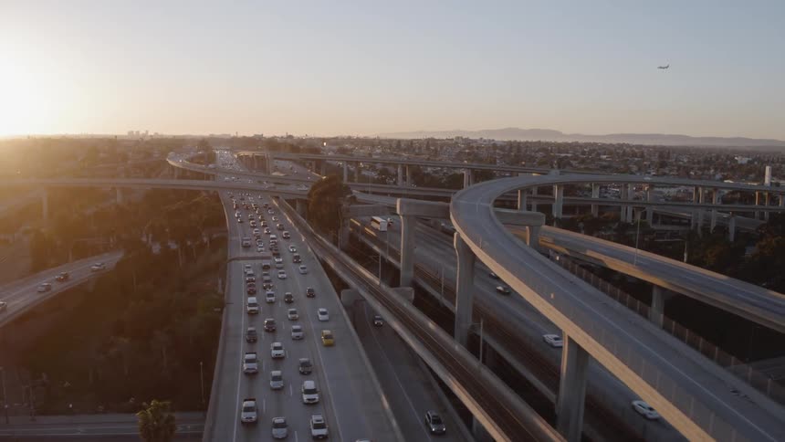 Traffic is backing up on a freeway in the morning