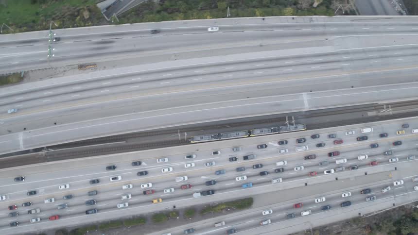 A train travels in between major highways