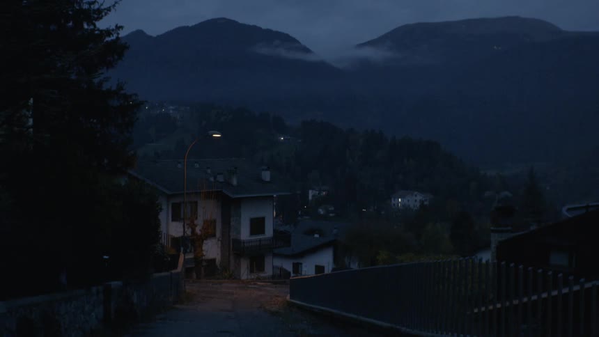 Night falls on a hilly resort town