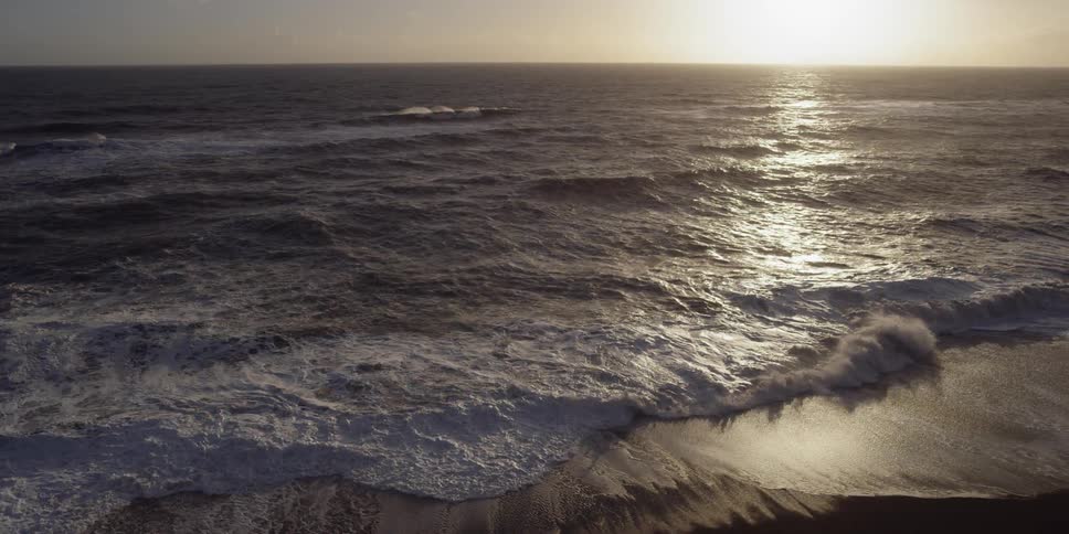 The sun sets over the ocean