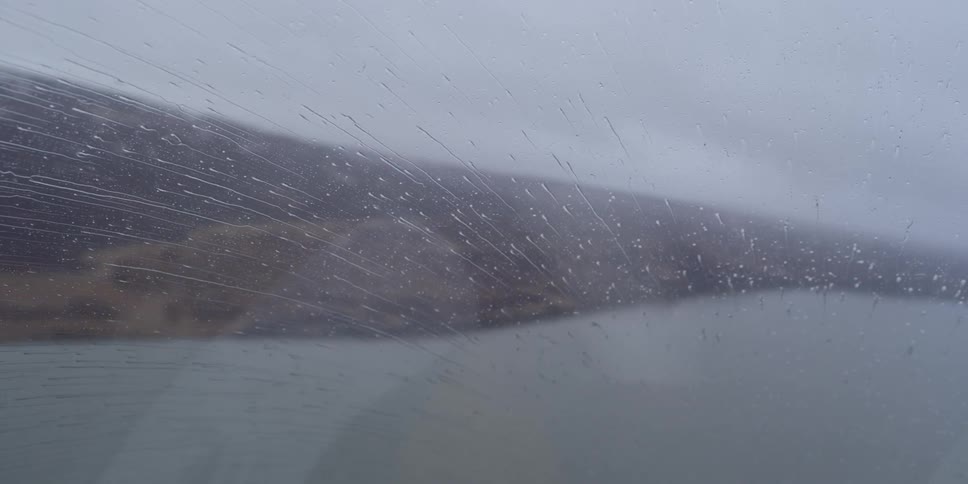 Rain is sweeping up a planes windshield