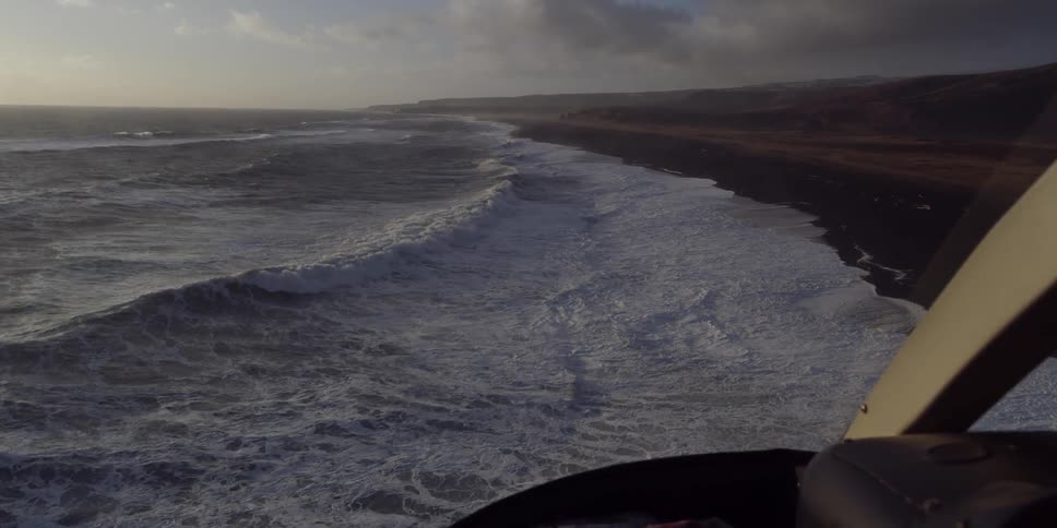 Waves roll to shore on a sunny day