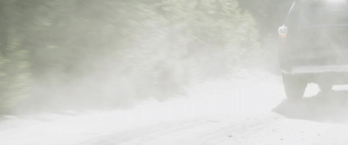 The car jumps up and down going over the dirt trail