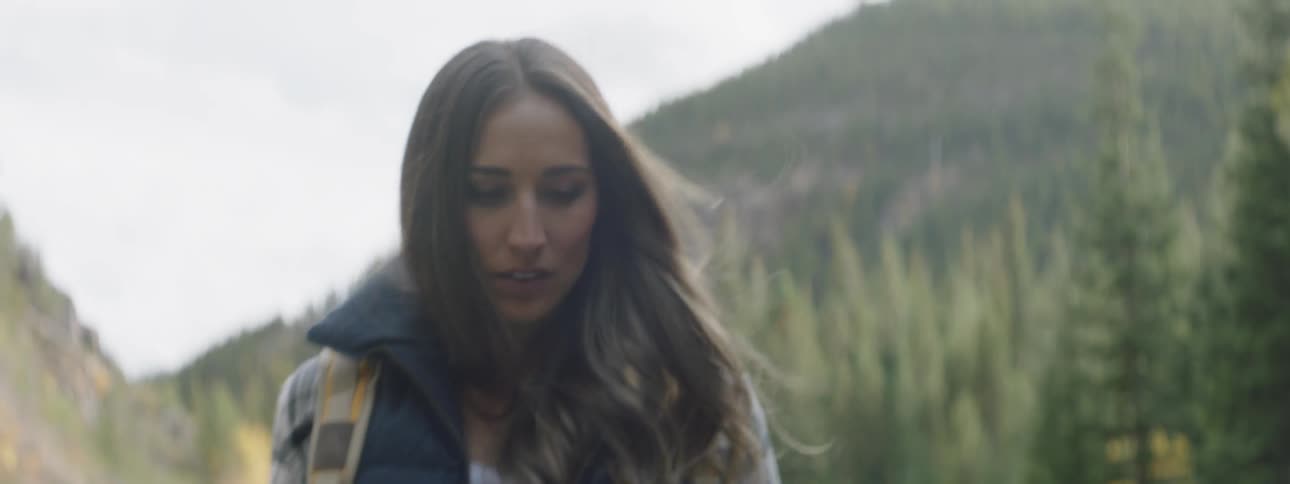 A woman hikes in a forest