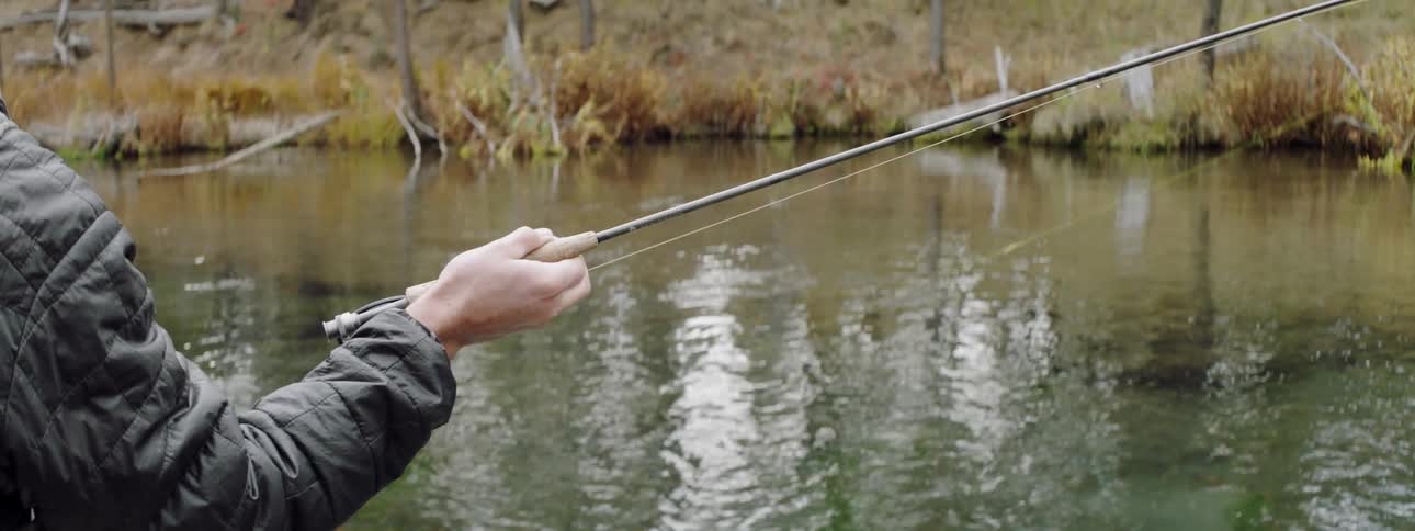 Man fishes on a river