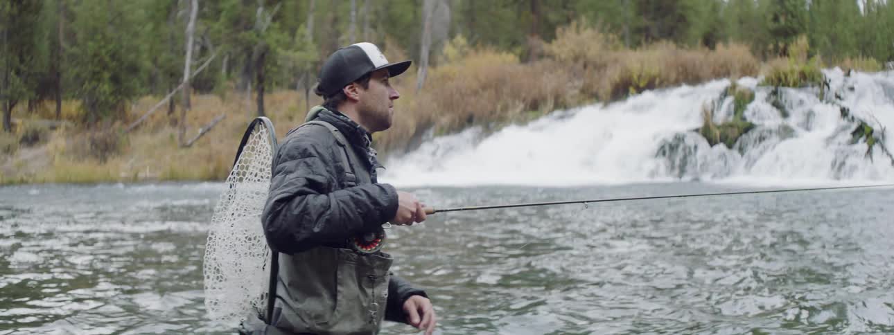 Man fishes in a river