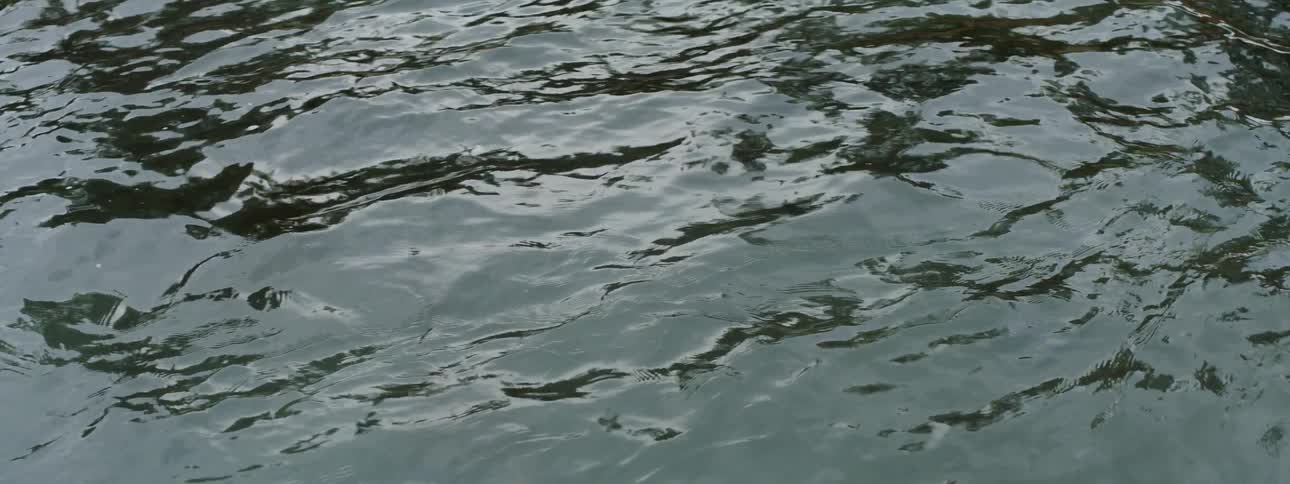 The water is reflecting the sun as it moves