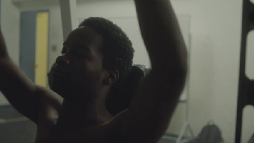 Man lifting weights in a gym