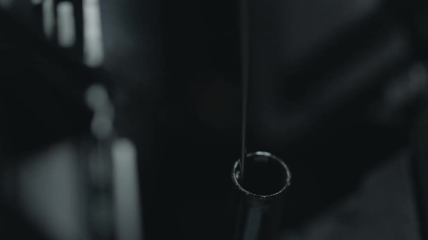 A person checks the oil in a car