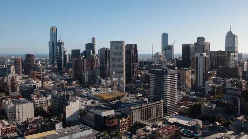Tall city buildings tower into the sky